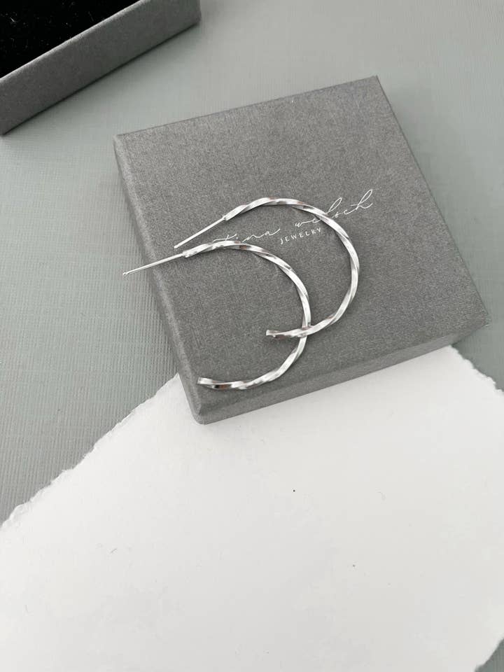 Large sparkly sterling silver twisted hoops for wholesale by Tina Welsch Jewelry