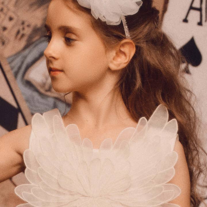 White Cheerful Shimmer Flower Headband for wholesale on Faire