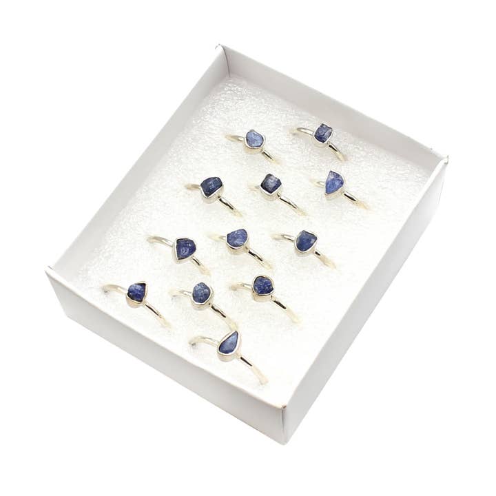 Set of 12 Box Assorted Shaped Blue Sapphire Raw Rings for wholesale by Earths Elements Wholesale