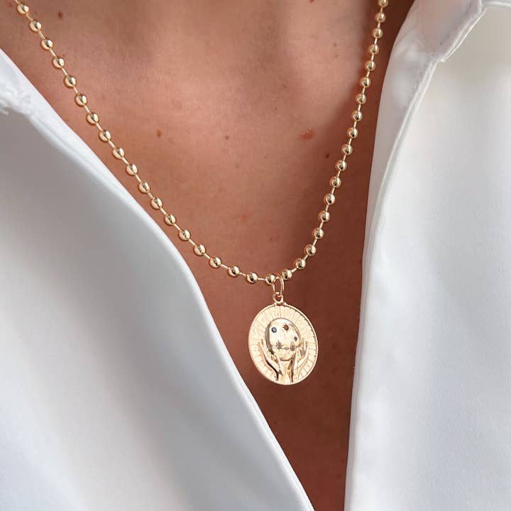 Hold the Universe Within – Gold Celestial Hands Necklace for wholesale by Georgina Nicol