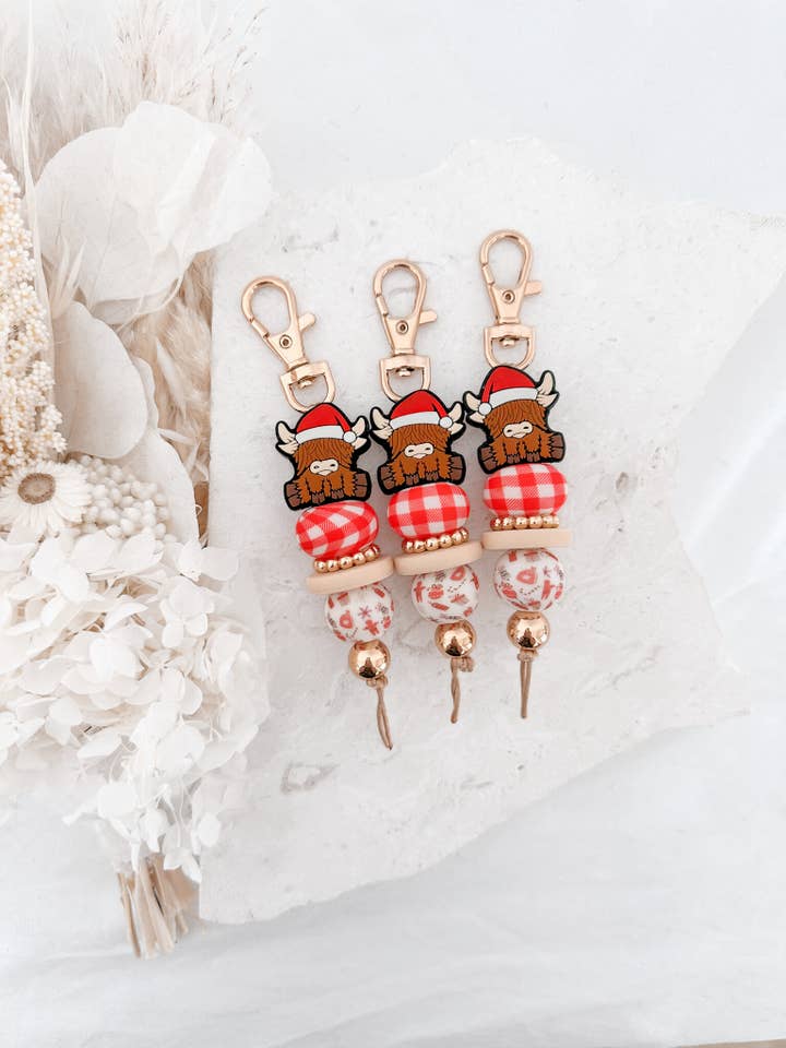 Nelly the Christmas Highland Cow Keychain for wholesale by Chuckle & Wood