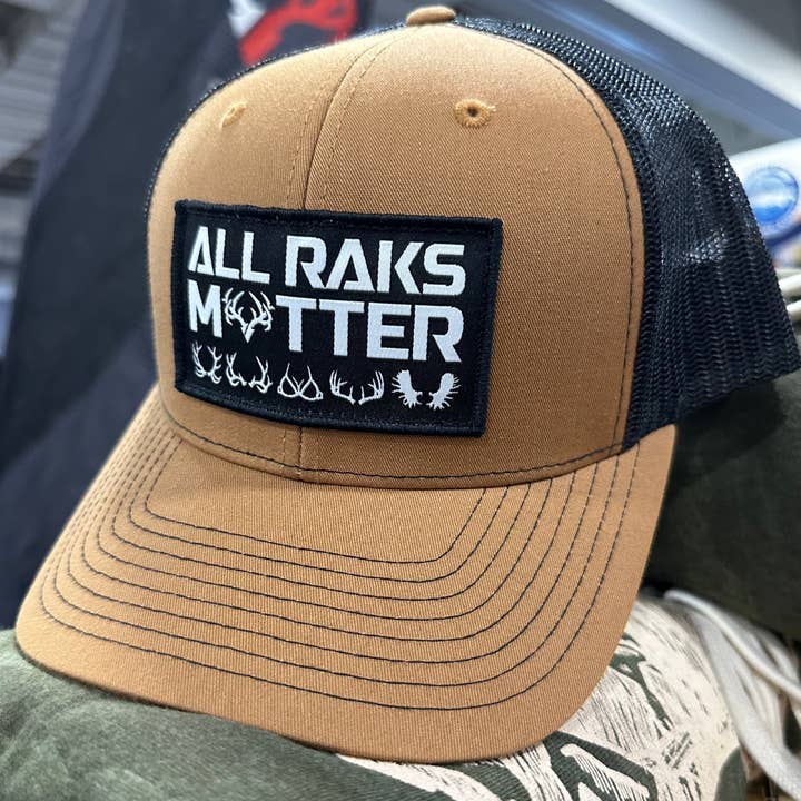 "All Raks Matter" Carmel/Black Snapback Trucker for wholesale by Rak•Adx Hunting Apparel
