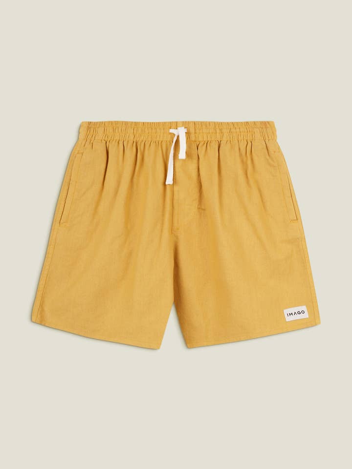 Shorts en lin doré pour la vente par Imago Portugal