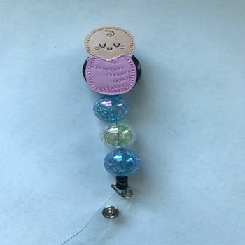Wholesale Trust Me I Know Breast Badge Reel for your store - Faire