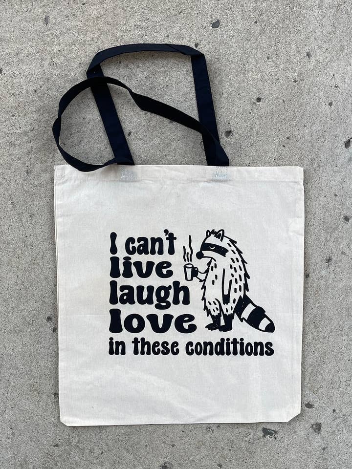 Bolso de mano con el lema «I can't LIVE LAUGH LOVE in these conditions» para venta al por mayor de Breakout Press Co.