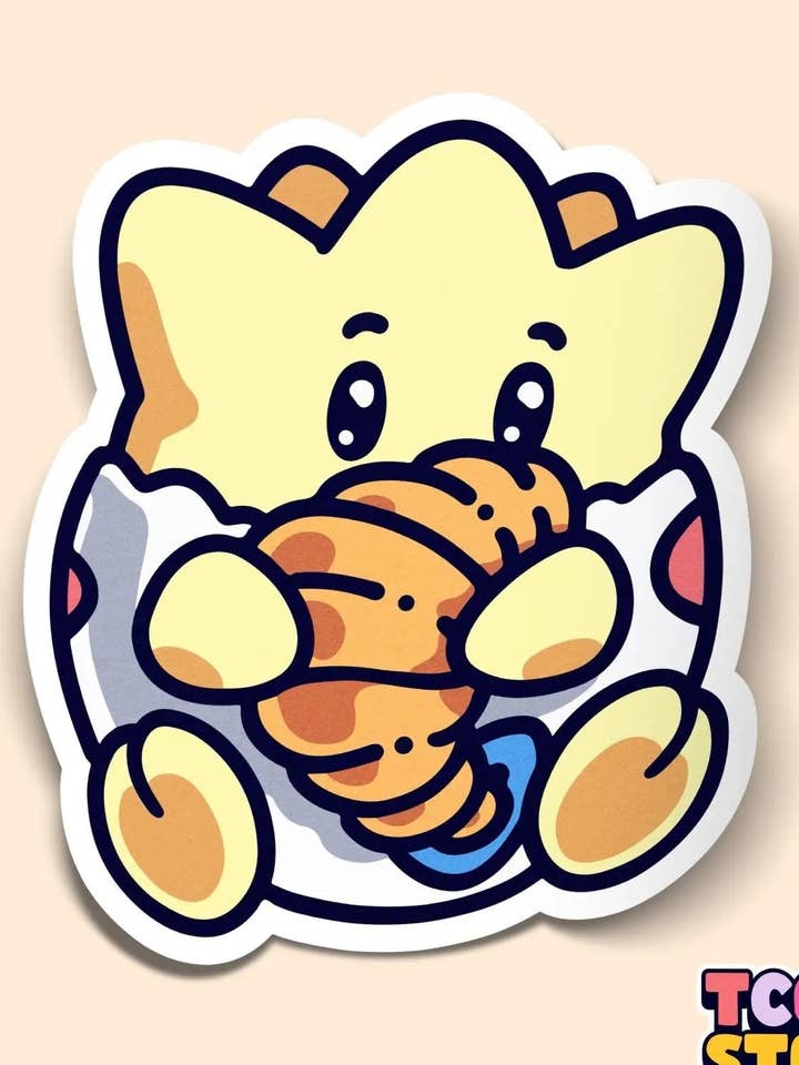 Togepi Pokémon Sticker: Holding Croissant for wholesale by TCG.Store - TCGDOTSTORE