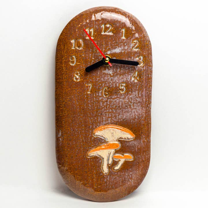 Jack-O'-Lantern Mushroom Ceramic Wall Clock Handmade in Ohio for wholesale by White Squirrel Clayworks
