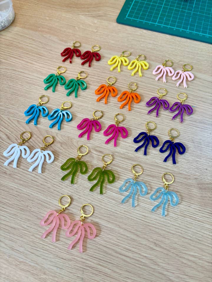 Colorful Bow Earrings — Acrylic Bow Huggie Hoops, Multiple Colours, Cute Statement Kawaii Bows, Handmade Colour-Blocked Earrings for wholesale by Squishy Jewellery