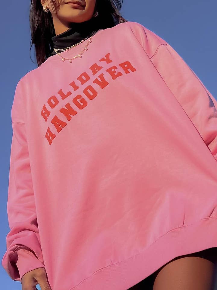 Pink Holiday Hangover Puff Sweatshirt for wholesale on Faire4