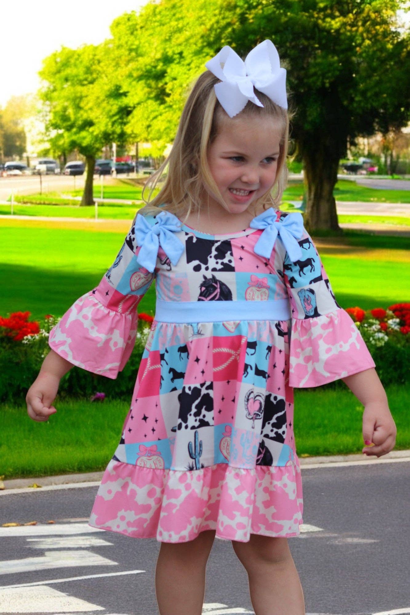 Kids Charm Online - Wholesale Dress - Kids - Beautiful wester patch printed girls dress with bows and cow printed hem.4