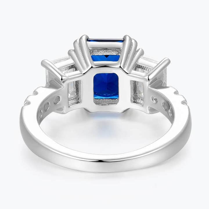 Dissoo® - Anello con 3 pietre con zaffiro blu smeraldo tagliato a smeraldo per la vendita all'ingrosso da parte di Dissoo