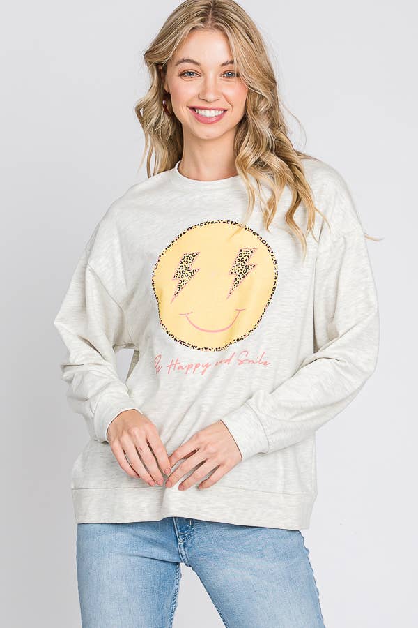 FARINA D'AVENA maglione con grafica «be happy and smile» con faccina felice in vendita all'ingrosso su Faire