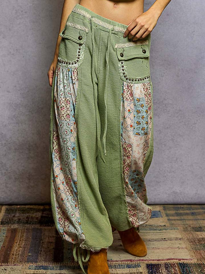 Elastic band floral print patch stud detail jogger pants for wholesale by Pol Clothing