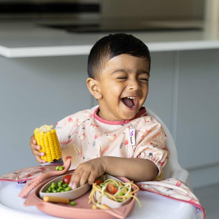 Cover & Catch Bib - Short Sleeve for wholesale by Tidy Tot US