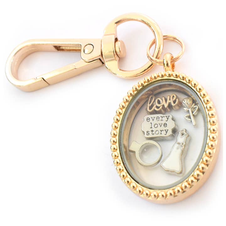 Love Story Wedding Gold Oval Locket Keyring. or necklace for wholesale by Amaya Rose Ltd.