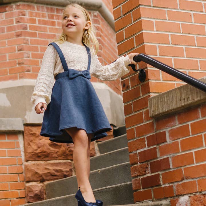 Navy Herringbone Fleece Bow Front Suspender Skirt - Baby for wholesale on Faire