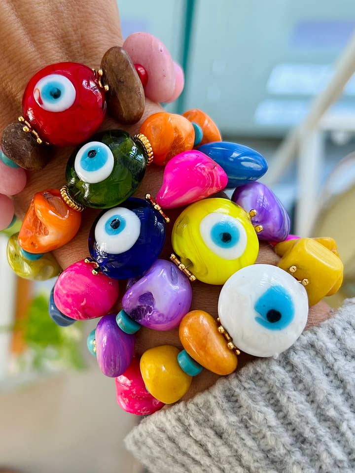 Braccialetti estivi colorati con perline a occhio di vetro e conchiglia per la vendita all'ingrosso da parte di Goupi