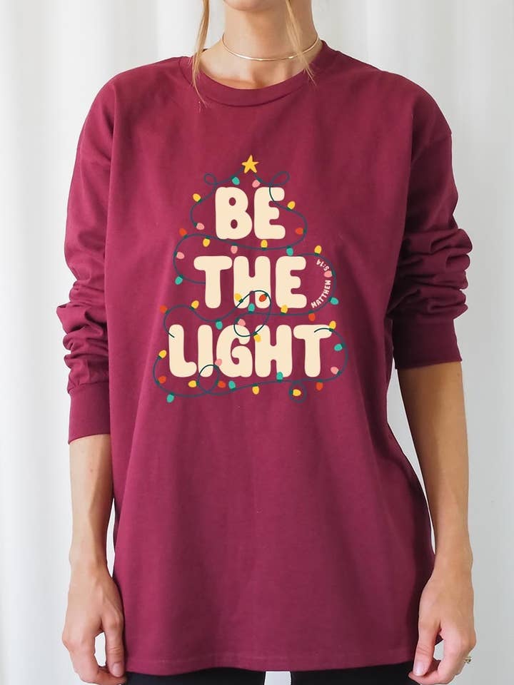 Be the Light Christmas Graphic Long Sleeve Tee for wholesale by COLORBEAR