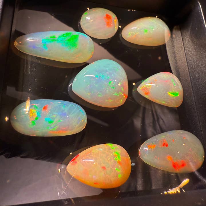 Welo Opal Cabochons – 8 pcs Jewelry-Grade Parcel (37.40 CT) for wholesale by Modeeq Gems
