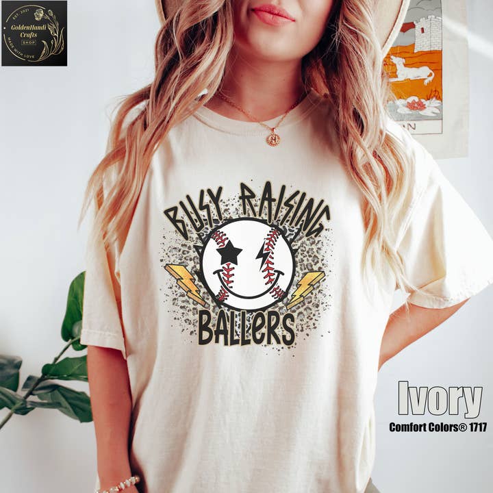 Comfort ColorsĀ® Retro Busy Raising Ballers Shirt, Game Day for wholesale by NVC Ecommerce LLC