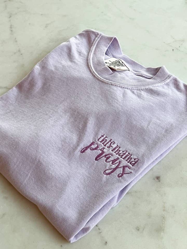 Orchid This Mama Prays Embroidery Tees Faith Based Christian Catholic Tshirts for wholesale on Faire1