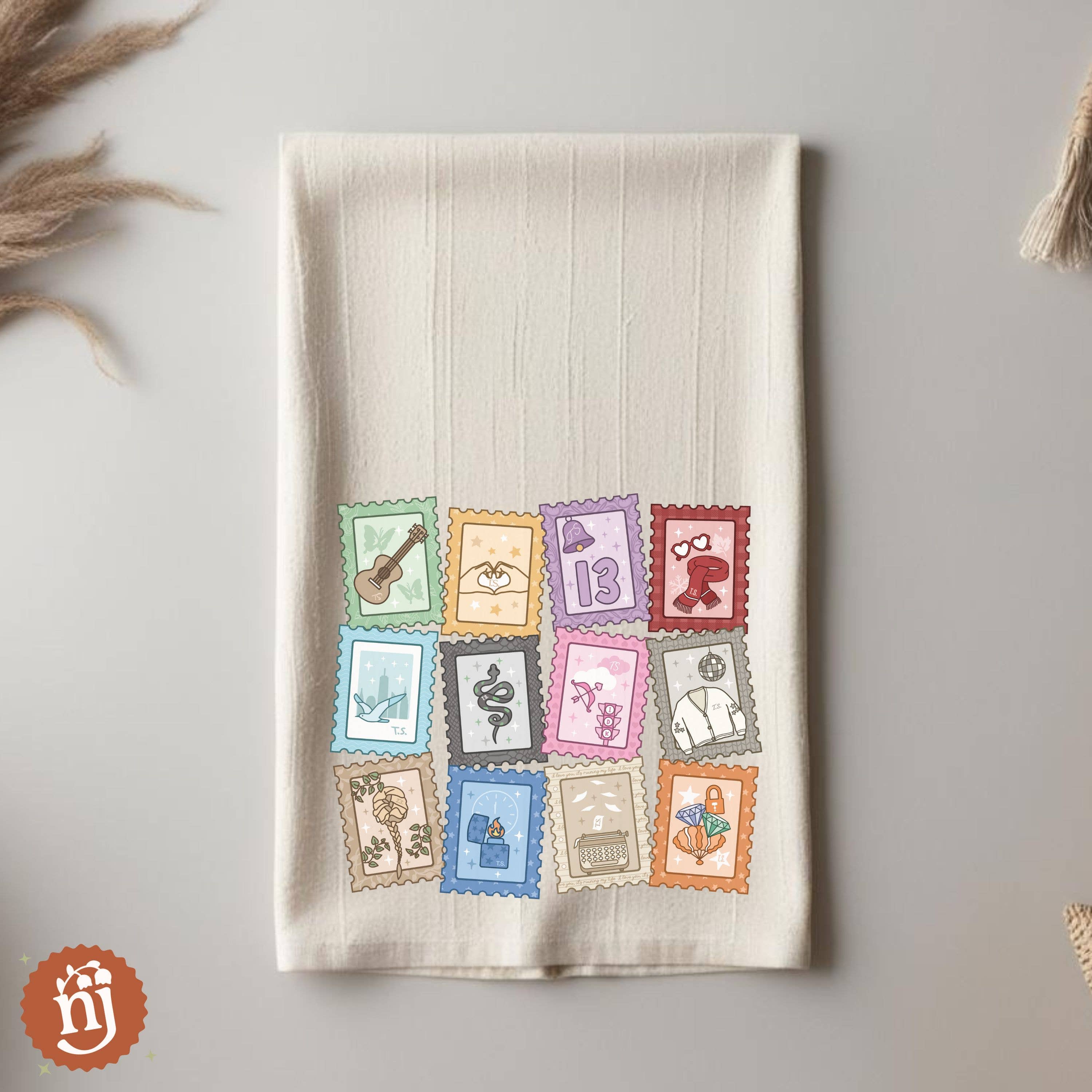 Nearly June Design Co - Wholesale Tea Towel - Eras Inspired Stamps Tea Towel