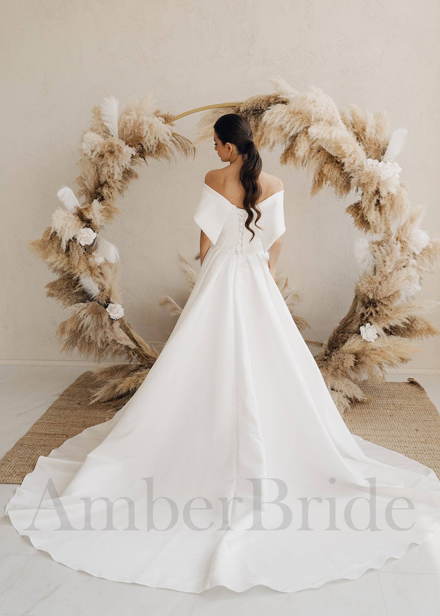 Amber Commerce Group, MB - Wholesale Gown - Women's - STOCK SELL-OUT: Simple A-Line Satin Wedding Dress with Off Shoulder Design and Corset1