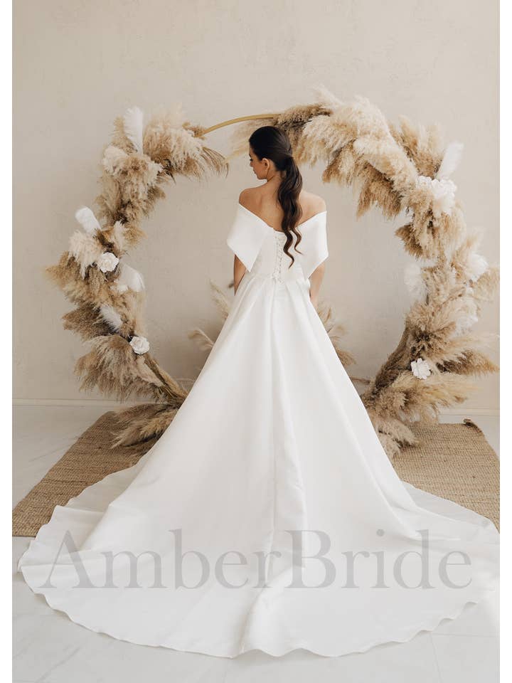 Amber Commerce Group, MB - Wholesale Gown - Women's - STOCK SELL-OUT: Simple A-Line Satin Wedding Dress with Off Shoulder Design and Corset1