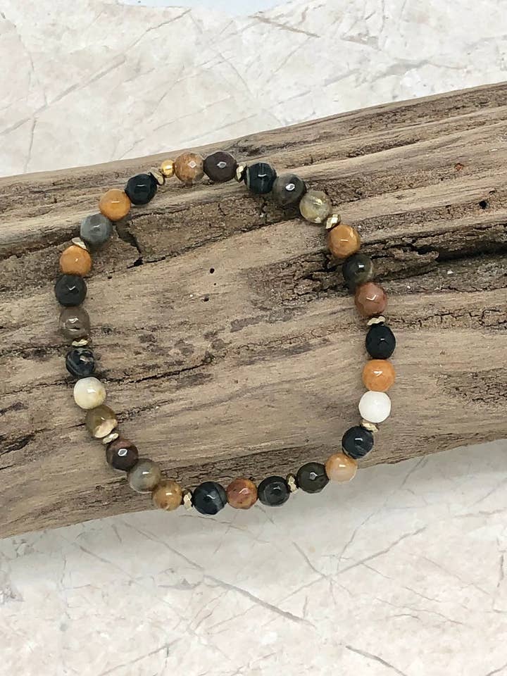 Bracelet Stretch African Wd. Fossil 6mm w/Gld Hematite 7.5” for wholesale by Rant & Rave Classic