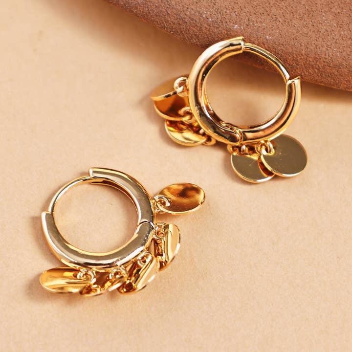 Round Dangle Disc Hoop Earrings and other Purchase Wholesale dischi. Free Returns & Net 60 Terms on Faire trending on Faire.