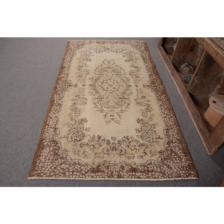 Classic Handmade Wool Rug in Cream and Brown for wholesale by The Loom Wholesale