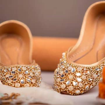 Quintessential Kundan Embellished Satin Gold Wedding Flats Jutti Khussa for wholesale on Faire