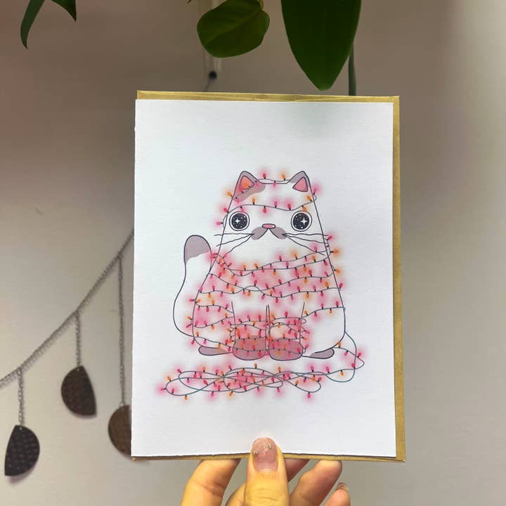 carte de vœux de chat avec guirlande lumineuse pour la vente par JusFleur