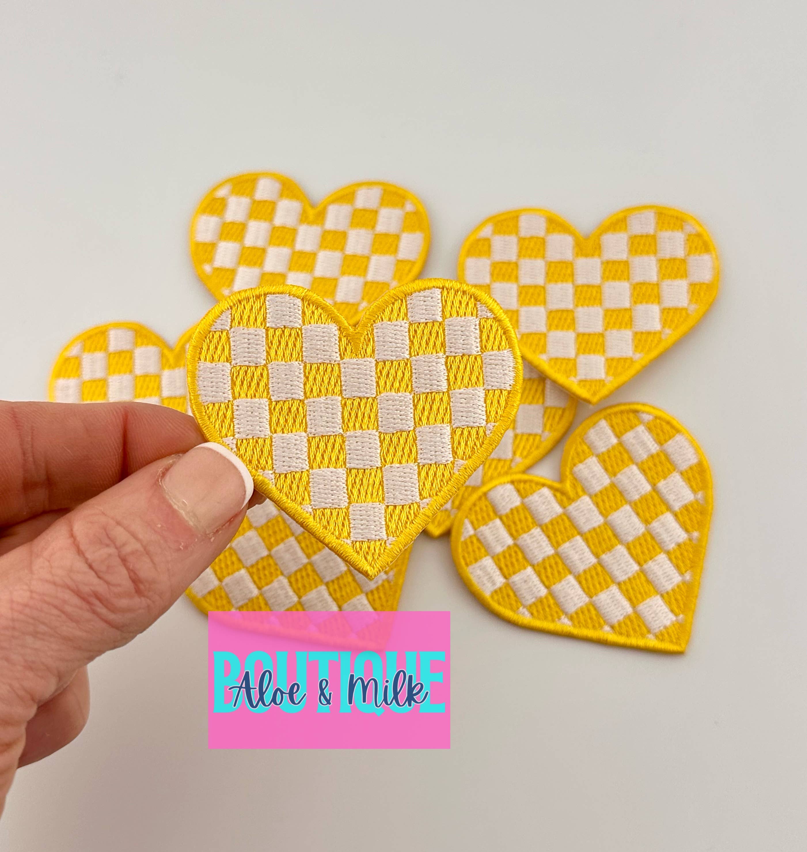 Aloe and Milk Boutique - Wholesale Hat Accessory - Women's - Checkered heart, heart patch, checkered patch, game day13