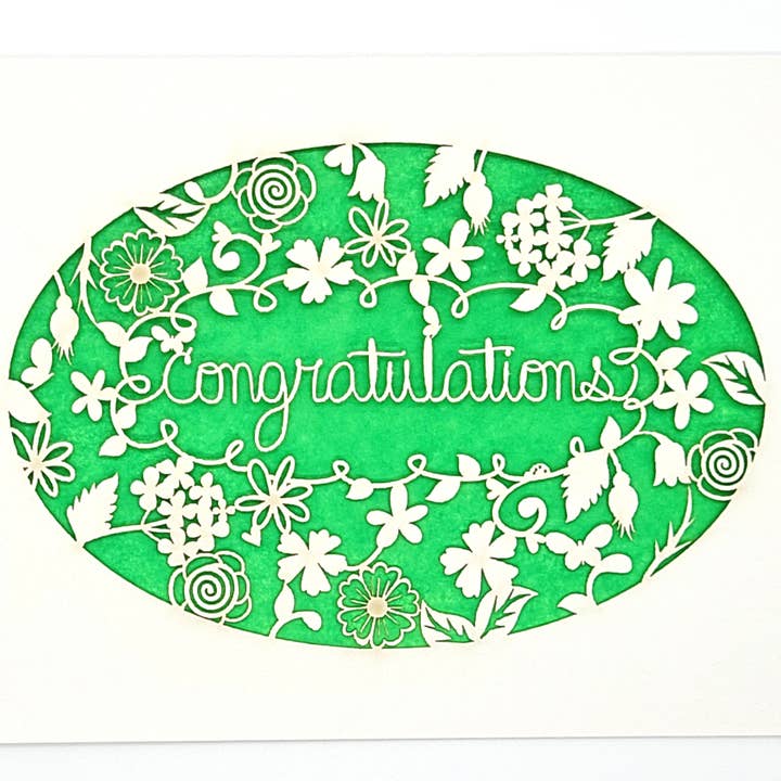 Grattis - krans av blommor för wholesale av two hermanas