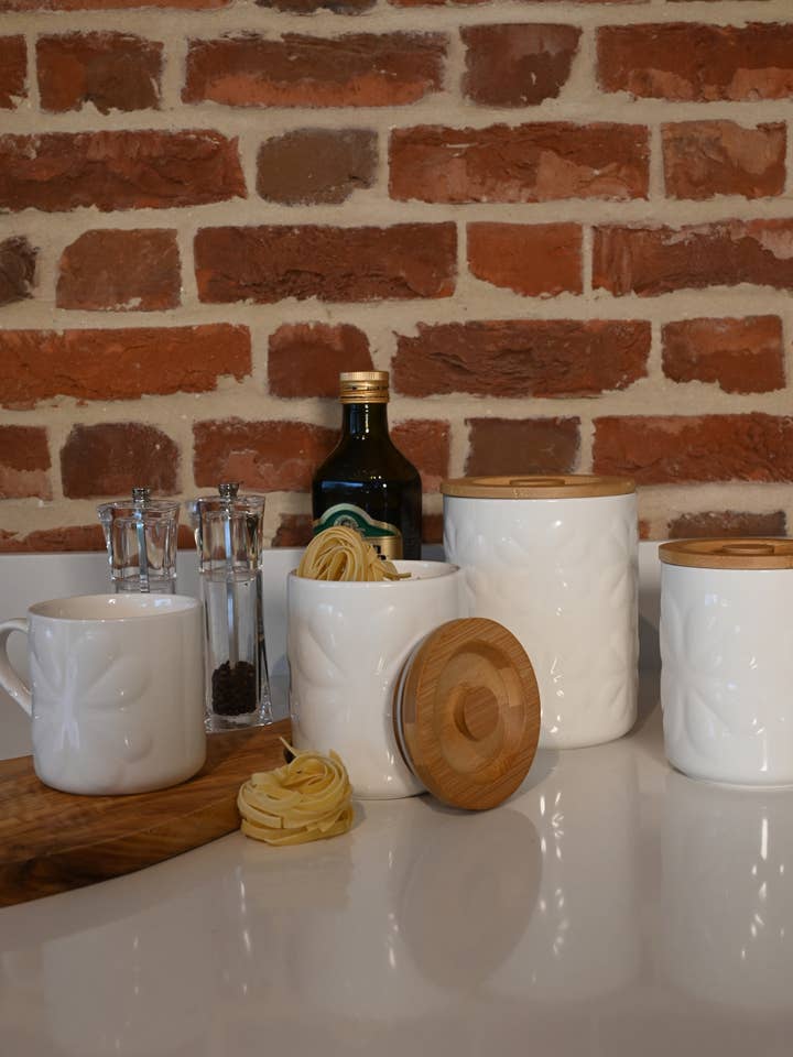 Carnaby Large Porcelain Embossed Jar Ivory with Bamboo Lid for wholesale by Navigate Ltd