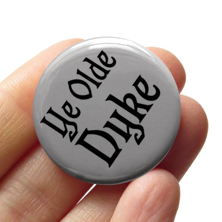 YE OLDE DYKE Lesbian 1.25" Pinback Button Queer Gay Gift for wholesale by Word For Word Factory