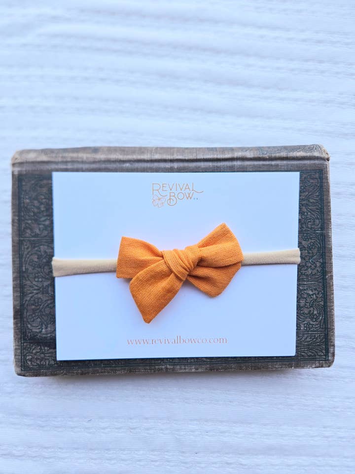 Mini Bow on Headband • Orange for wholesale by Revival Bow Co.