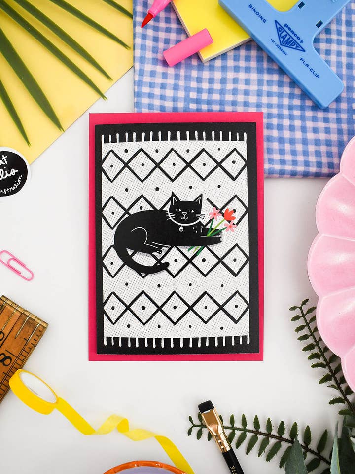 Black Cat on a Mat - Cute Monochrome Greetings Card for wholesale by Nat Ellis Illustration