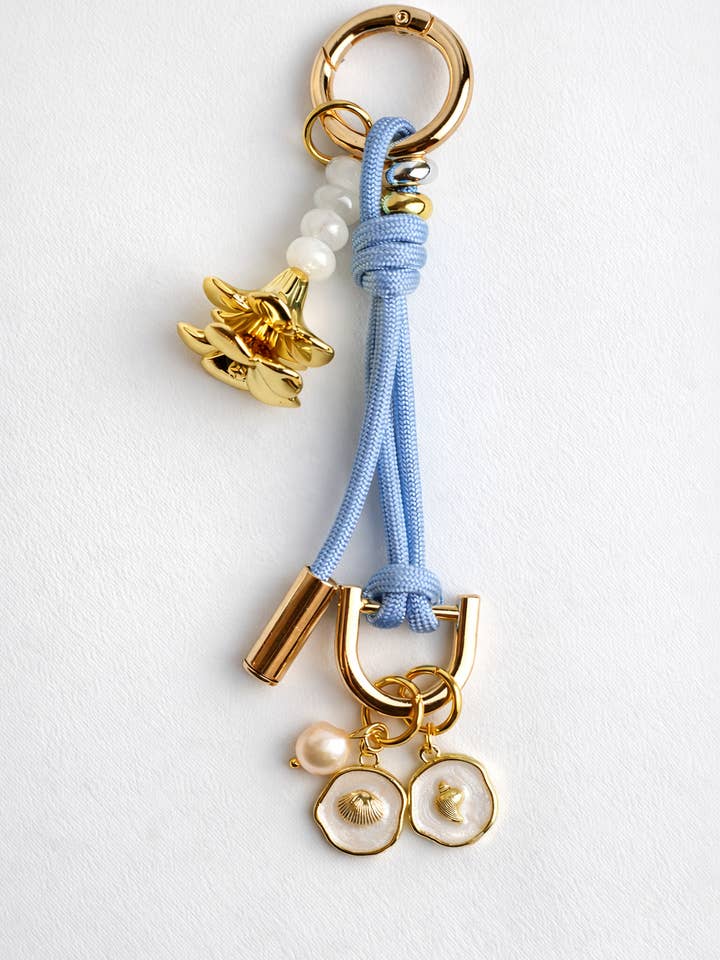 Leo Charm – Bag & Accessory Charm (Baby Blue, Plumeria) for wholesale by Leo & Lei