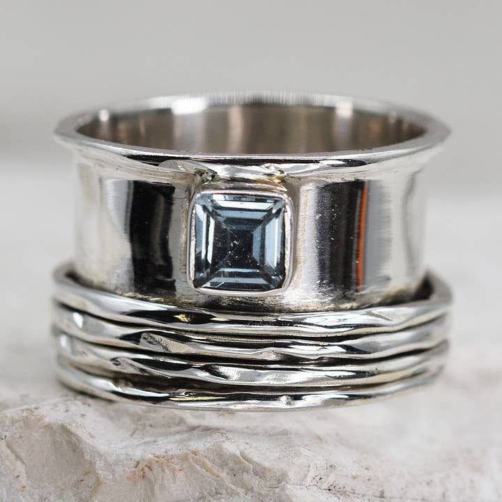 925 Spinning ring with blue topaz - Size 11 for wholesale by Tempest Designs