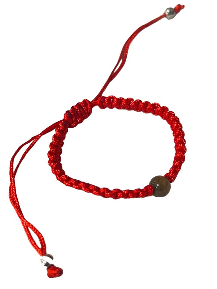 INFANT BRACELET: PLAIN RED THREADED W/ TIGER EYE BEAD for wholesale by SAN JUDITAS RELIGIOUS ARTICLES