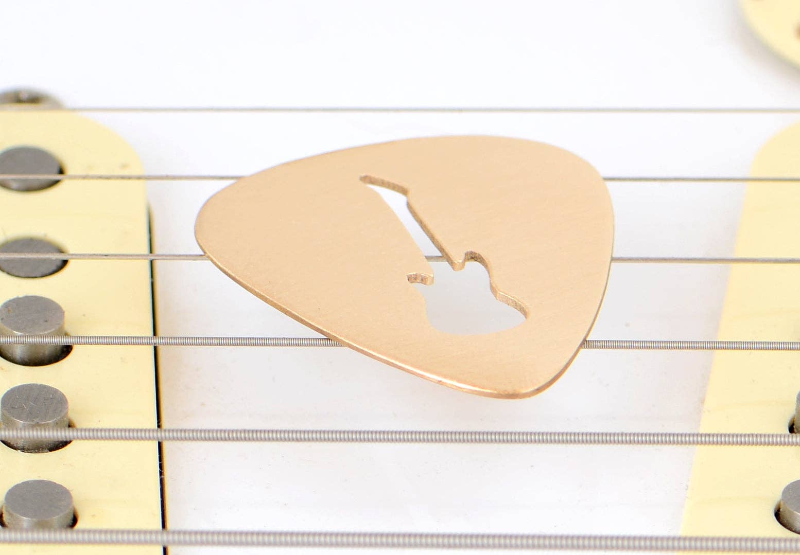 NiciArt LLC - Wholesale Music Accessory - Guitar Pick rocking out a Guitar Cut Out in Bronze1