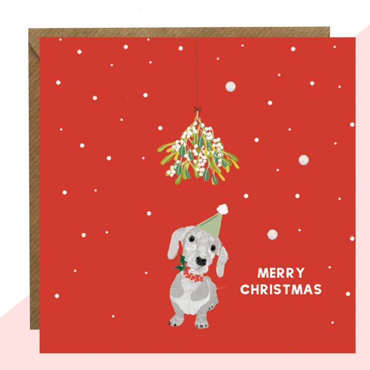 Carte de Noël rouge Sausage Dog pour la vente par Lottie Simpson