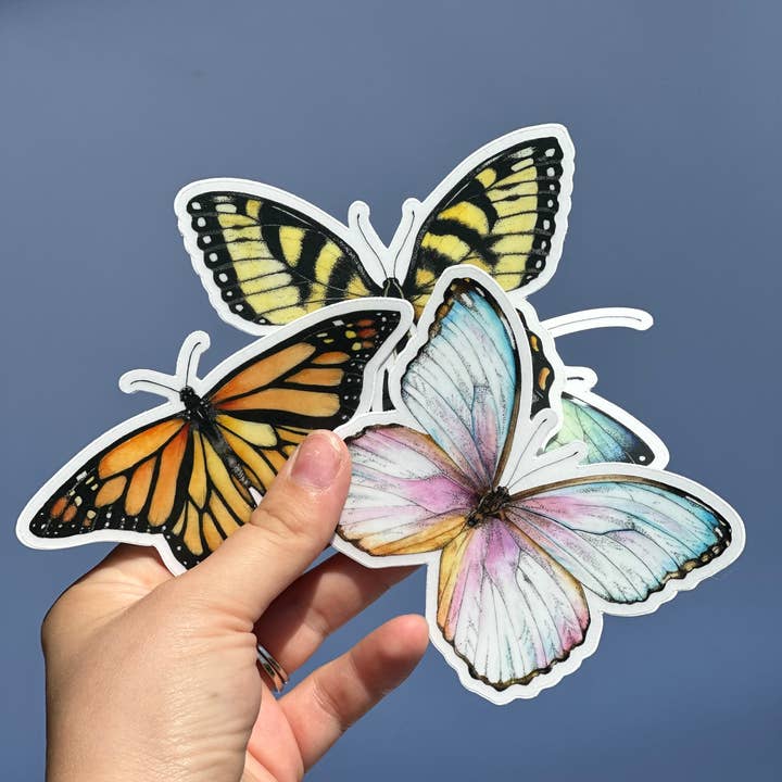 CMCARTILLUSTRATIONS – Großhandel Aufkleber – Blauer Schmetterlings-Aufkleber aus transparentem Vinyl, wasserfest, gestanzt