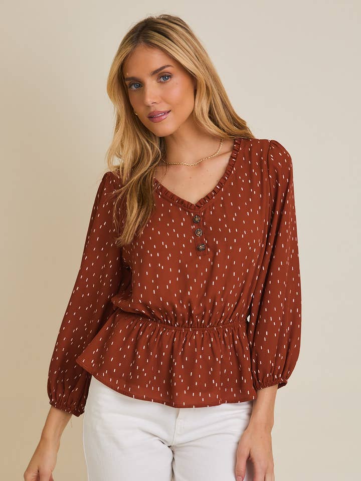 HAUT ABSTRAIT À MANCHES LONGUES ÉVASÉES AVEC BOUTONS ET COL EN V pour la vente par GILLI