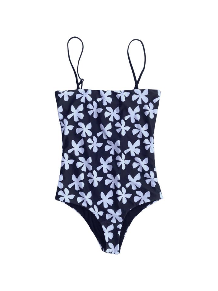 Costume intero da donna con spalline in plumeria nera per la vendita all'ingrosso da parte di Of One Sea
