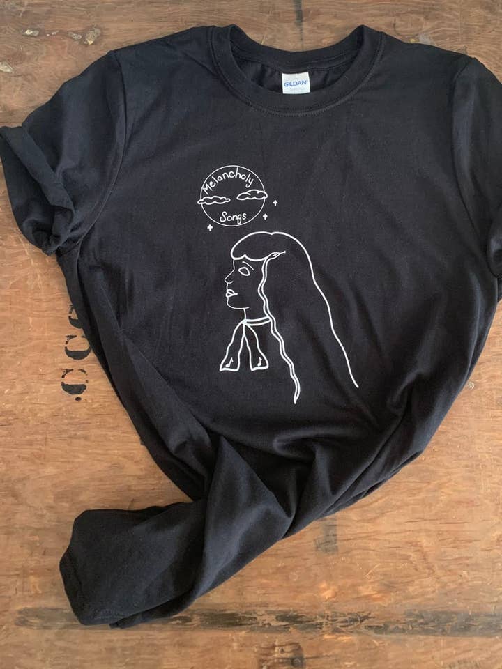 MELANCHOLY SONGS T-shirt voor wholesale door Slow Dog Designs