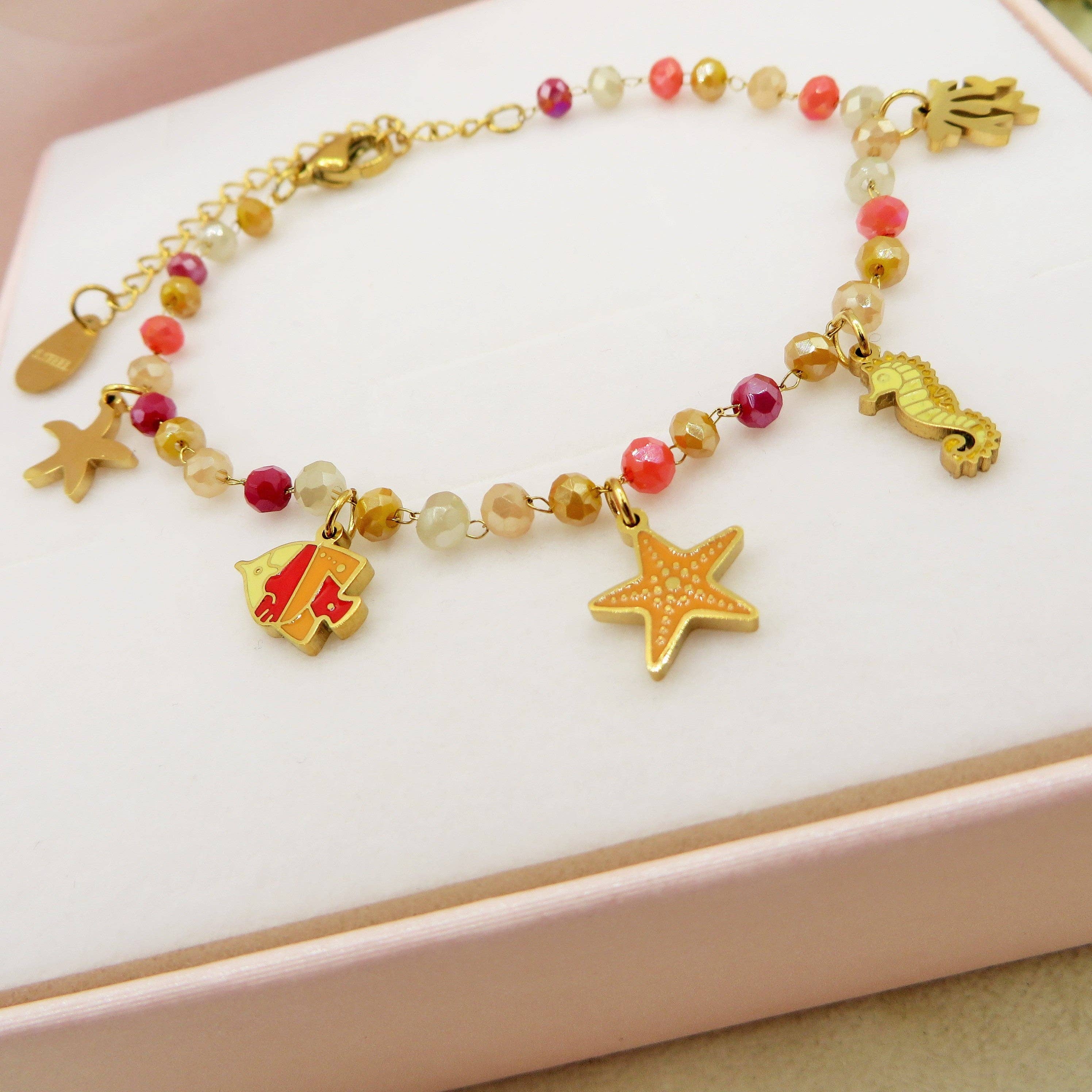 BIEGE COCCIO MAORI ~ Bracciale ACCIAIO INOSSIDABILE con cristalli e ciondoli marini for wholesale on Faire2