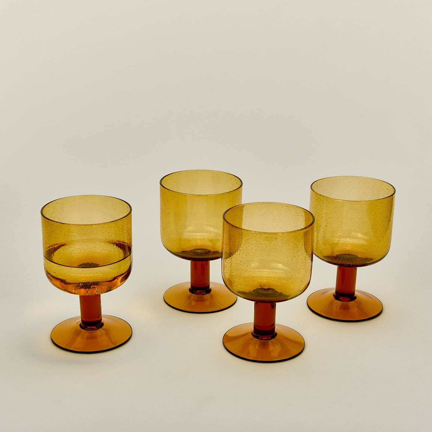 Hawkins New York – wholesale Drinking glass/cup – SIMPLE SEEDED GLASSWARE - STEMMED - SET OF 4, AMBER4